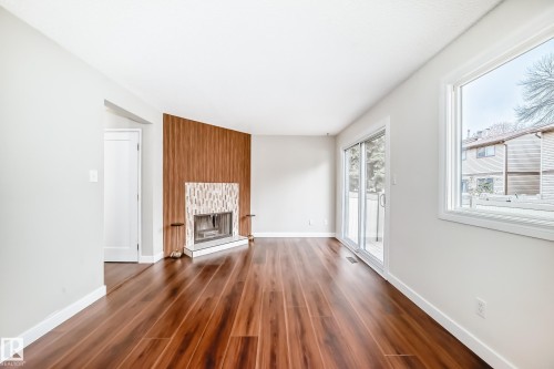 1189 Hooke Road, Edmonton, AB - Indoor Photo Showing Other Room With Fireplace