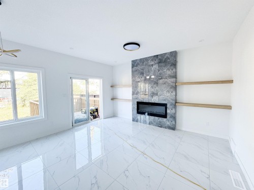 1314 35 Street, Edmonton, AB - Indoor Photo Showing Living Room With Fireplace