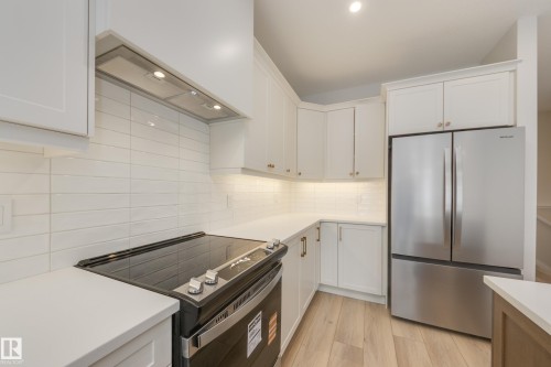 195 Stonehouse Way, Leduc, AB - Indoor Photo Showing Kitchen With Stainless Steel Kitchen With Upgraded Kitchen