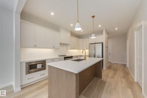 195 Stonehouse Way, Leduc, AB - Indoor Photo Showing Kitchen With Stainless Steel Kitchen With Upgraded Kitchen