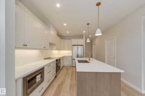195 Stonehouse Way, Leduc, AB - Indoor Photo Showing Kitchen With Stainless Steel Kitchen With Upgraded Kitchen