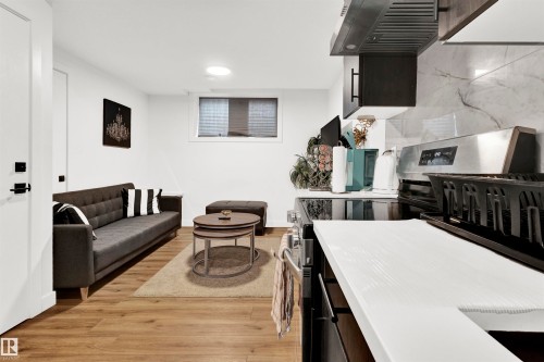 Living area with light wood finished floors - 9559 85 Street, Edmonton, AB - Indoor