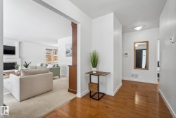 Corridor with wood-type flooring and baseboards - 