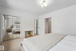 Bedroom with carpet floors and two closets - 