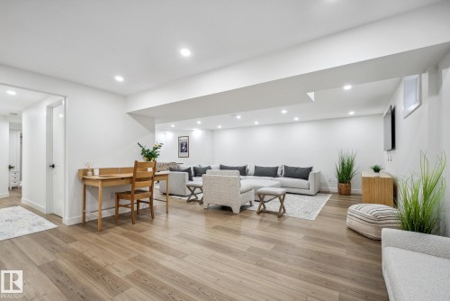 Living room with light wood-type flooring and recessed lighting - 14018 100 Avenue, Edmonton, AB - Indoor