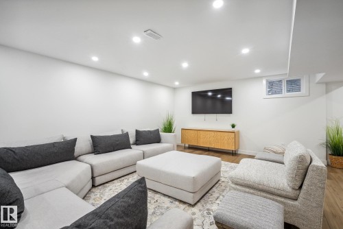 Living area with recessed lighting and wood finished floors - 14018 100 Avenue, Edmonton, AB - Indoor
