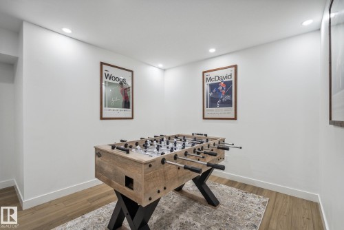 Recreation room with light wood-type flooring and recessed lighting - 14018 100 Avenue, Edmonton, AB - Indoor
