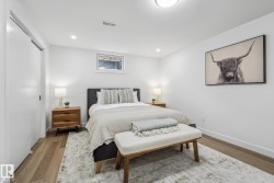 Bedroom with wood finished floors, a closet, and recessed lighting - 