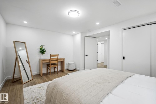 Bedroom with light wood-style flooring, a desk, and recessed lighting - 14018 100 Avenue, Edmonton, AB - Indoor Photo Showing Bedroom