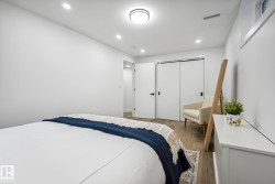 Bedroom featuring wood finished floors, recessed lighting, and a closet - 