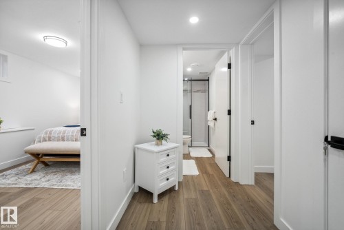 Hallway featuring light wood-type flooring and recessed lighting - 14018 100 Avenue, Edmonton, AB - Indoor Photo Showing Other Room