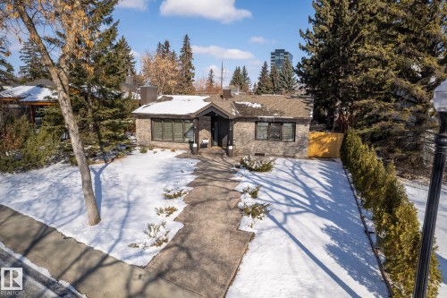 View of front of house with a chimney and brick siding - 14018 100 Avenue, Edmonton, AB - Outdoor