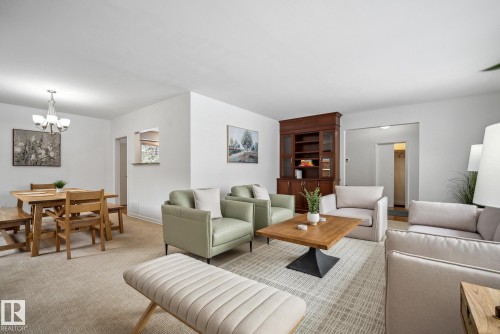 Living area featuring a chandelier and carpet flooring - 14018 100 Avenue, Edmonton, AB - Indoor Photo Showing Living Room