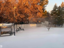 View of yard layered in snow - 
