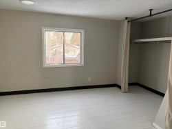 Unfurnished bedroom with a textured ceiling and a closet - 