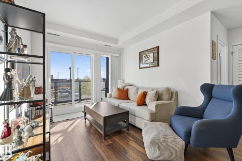 218 1316 Windermere Way, Edmonton, AB - Indoor Photo Showing Living Room