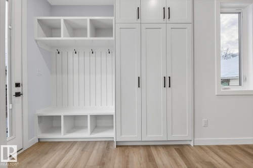 Mudroom featuring light wood-style flooring and baseboards - 9627 152 Street Nw, Edmonton, AB - Indoor Photo Showing Other Room