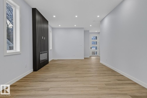 Spare room with light wood-style flooring and recessed lighting - 9627 152 Street Nw, Edmonton, AB - Indoor Photo Showing Other Room