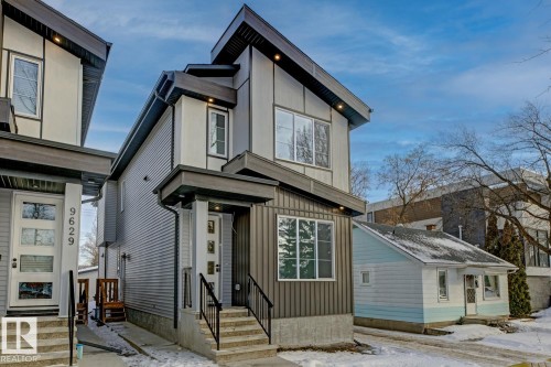 Modern home featuring board and batten siding and entry steps - 9627 152 Street Nw, Edmonton, AB - Outdoor With Facade