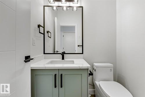 Bathroom featuring vanity and toilet - 9627 152 Street Nw, Edmonton, AB - Indoor Photo Showing Bathroom