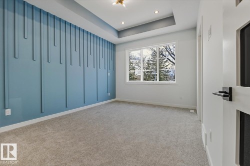 Unfurnished room with light carpet, a raised ceiling, and recessed lighting - 9627 152 Street Nw, Edmonton, AB - Indoor Photo Showing Other Room