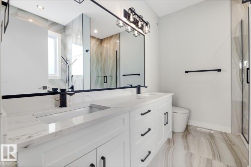 Bathroom with a marble finish shower and double vanity - 9627 152 Street Nw, Edmonton, AB - Indoor Photo Showing Bathroom