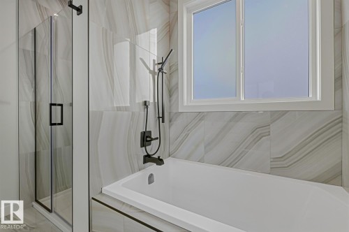 Bathroom with a marble finish shower and double vanity - 9627 152 Street Nw, Edmonton, AB - Indoor Photo Showing Bathroom