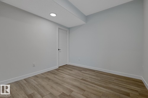 Unfurnished room with light wood finished floors and baseboards - 9627 152 Street Nw, Edmonton, AB - Indoor Photo Showing Other Room