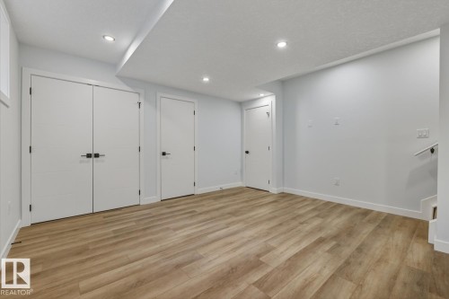 Unfurnished living room featuring recessed lighting and light wood-style flooring - 9627 152 Street Nw, Edmonton, AB - Indoor Photo Showing Other Room