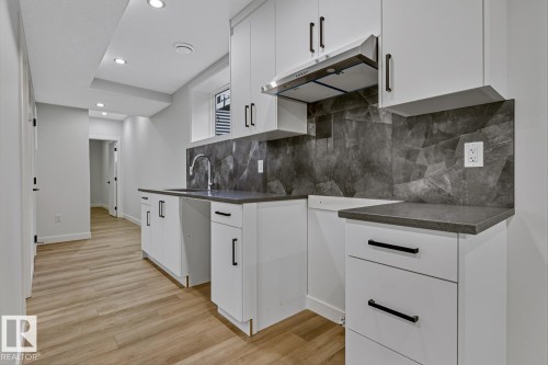 Bathroom featuring vanity and shower / bath combination - 9627 152 Street Nw, Edmonton, AB - Indoor Photo Showing Bathroom
