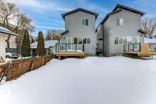 Snow covered property with a deck - 9627 152 Street Nw, Edmonton, AB - Outdoor With Deck Patio Veranda With Exterior