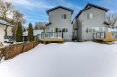 Snow covered property with a deck - 9627 152 Street Nw, Edmonton, AB  - Outdoor With Deck Patio Veranda With Exterior 