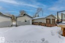 Snow covered property with an outdoor structure and stucco siding - 9627 152 Street Nw, Edmonton, AB  - Outdoor 