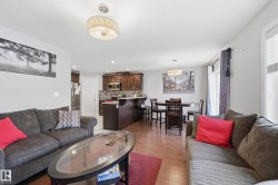 Living room featuring light wood-style floors and recessed lighting - 