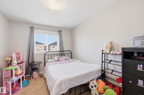Bedroom with carpet and baseboards - 5978 167C Avenue, Edmonton, AB - Indoor Photo Showing Bedroom
