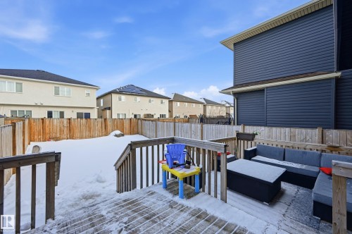 Wooden terrace with a residential view, a fenced backyard, and an outdoor hangout area - 5978 167C Avenue, Edmonton, AB - Outdoor With Deck Patio Veranda With Exterior