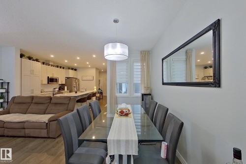 Dining space featuring light wood finished floors and recessed lighting - 4419 Kinsella Green, Edmonton, AB - Indoor Photo Showing Dining Room