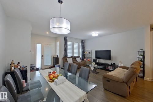 Dining space featuring wood finished floors - 4419 Kinsella Green, Edmonton, AB - Indoor Photo Showing Dining Room