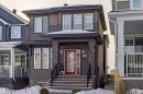 View of front facade featuring stone siding - 4419 Kinsella Green, Edmonton, AB  - Outdoor With Facade 