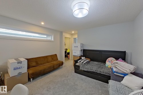 Carpeted bedroom with recessed lighting and a textured ceiling - 4419 Kinsella Green, Edmonton, AB - Indoor Photo Showing Bedroom