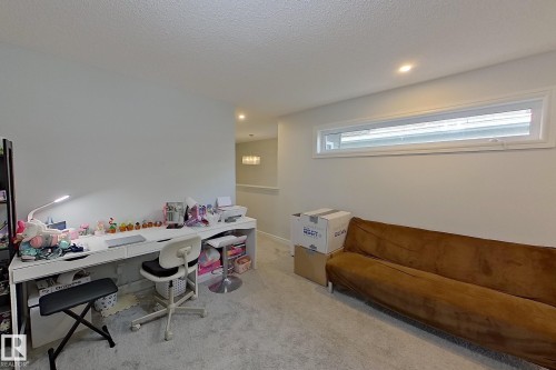 Home office with carpet, recessed lighting, and a textured ceiling - 4419 Kinsella Green, Edmonton, AB - Indoor Photo Showing Office