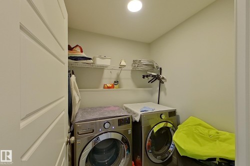 Laundry room with independent washer and dryer - 4419 Kinsella Green, Edmonton, AB - Indoor Photo Showing Laundry Room