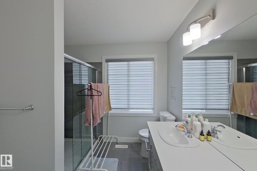 Full bath with a stall shower and vanity - 4419 Kinsella Green, Edmonton, AB - Indoor Photo Showing Bathroom