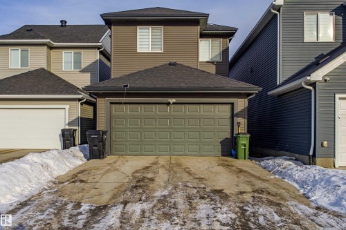 View of front facade featuring roof with shingles and concrete driveway - 4419 Kinsella Green, Edmonton, AB - Outdoor