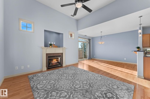 302 2503 Hanna Crescent, Edmonton, AB - Indoor Photo Showing Other Room With Fireplace