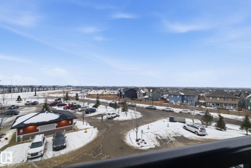 Snowy aerial view featuring a residential view - 424 1510 Watt Drive, Edmonton, AB - Outdoor With View