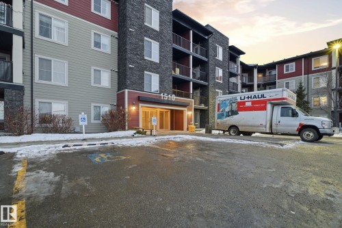 Property at dusk with a view of apartment building / complex - 424 1510 Watt Drive, Edmonton, AB - Outdoor With Balcony