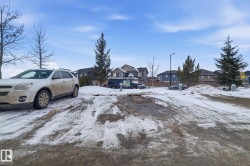 Yard layered in snow featuring a residential view - 