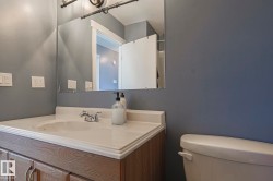 Bathroom featuring vanity and toilet - 