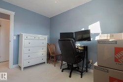 Office space featuring baseboards and light carpet - 